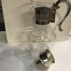 Vintage coffee carafe with silver handle and lid