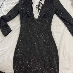 Black sequin maxi dress with long sleeves and tie back