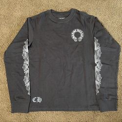Grey longsleeve with graphics all around it