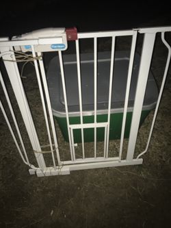 Like new walk-through gate with pet door And extension kit only 40 firm
