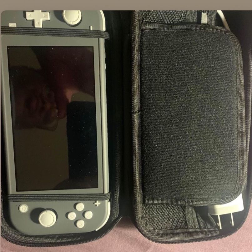 Grey Nintendo Swith Lite (including games and accessories)