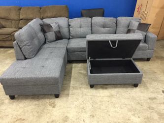 Gray linen sectional couch and ottoman