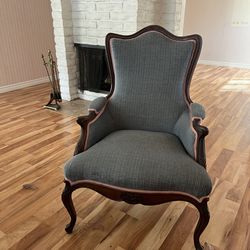 Fully upholstered Victorian style walnut armchair.