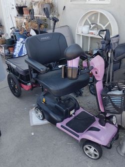 Purple electric mobility scooter