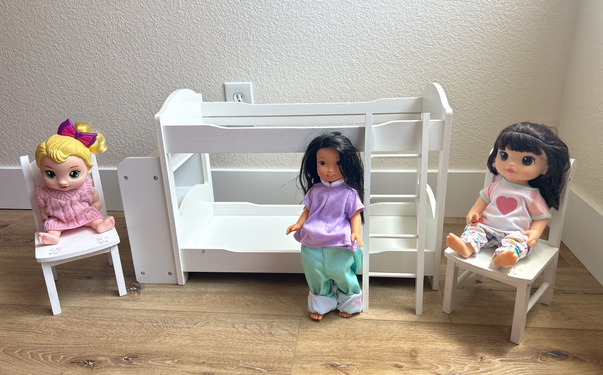 Dolls And Wooden Doll Bed