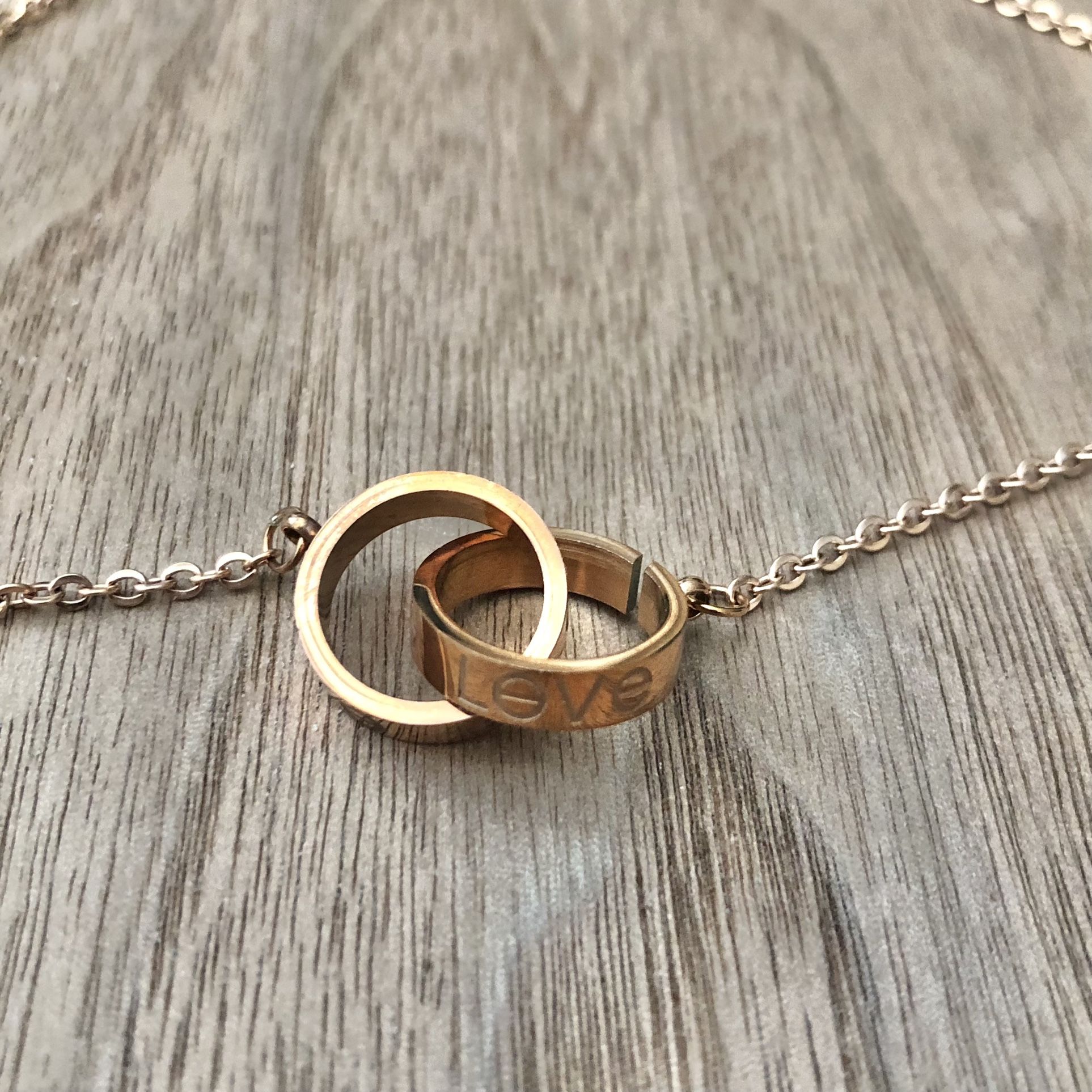 Fashion jewelry necklace interlocking ring