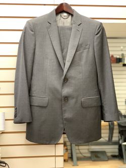 Suit for men. BURBERRY Brand. Retail for. $1.990. Two buttons. English Cut. Flat front slacks 42 chest 33 waist in perfect condition