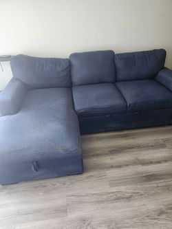 Blue couch with underneath storage