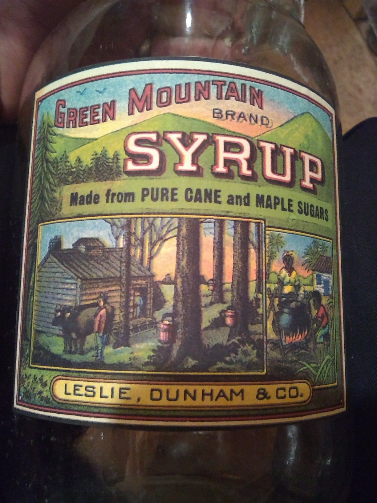 Three black Americana syrup jugs