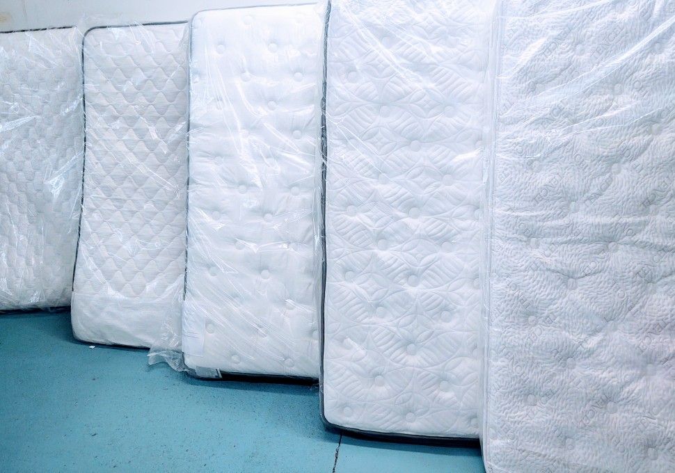 Brand New Mattresses In The Factory Plastic