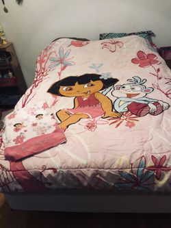 Twin size reversible Dora comforter and flat sheet in used but good condition. Washed and clean!