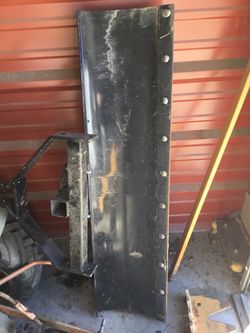 Scraping blade for utility vehicle