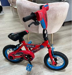 Huffy Marvel Spider-Man kid's bike, featuring a red frame