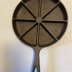 Vintage cast-iron cornbread skillet round with 8 sliced sections, made USA
