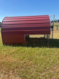 Red Metal Hay Feeder with Roof Cover
