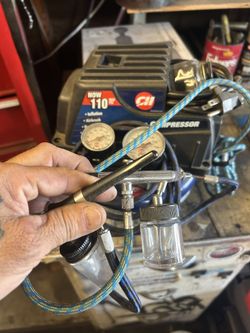 Compressor with two air airbrush guns asking $100 no less