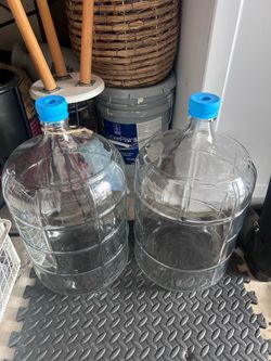2- five gallon water jugs