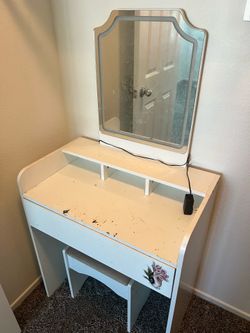 Vanity with lighted mirror