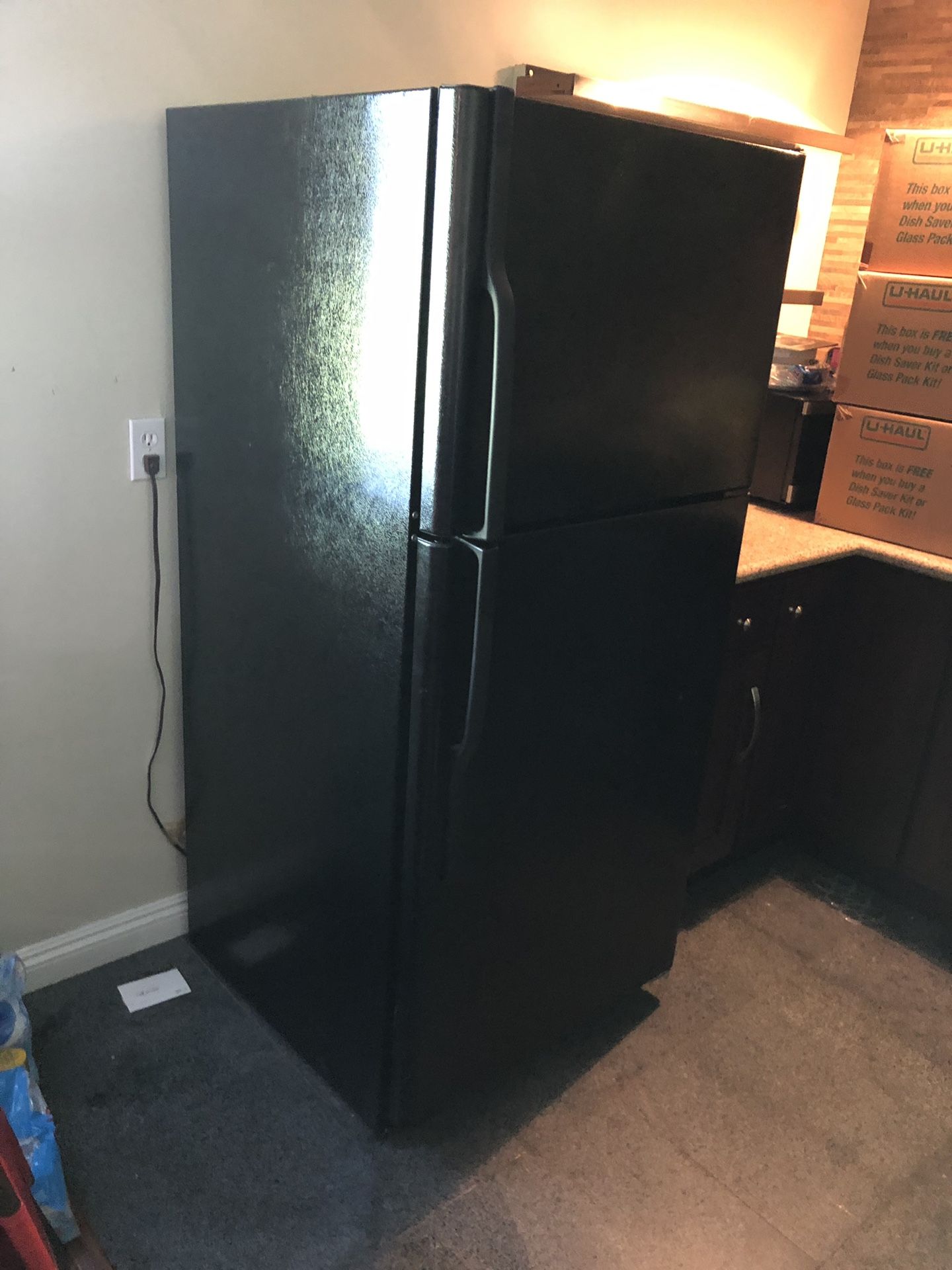 GE BLACK REFRIGERATOR WITH ICE MAKER. Moving - MUST BE ABLE TO PICK UP!
