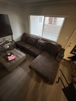 Brown U-shaped sectional couch