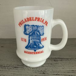 Philadelphia Bicentennial Milk Glass 1 Coffee Mug Liberty Bell  4 5/8” tall. Holds 12 oz. Graphics on one side.  Red White And Blue 
