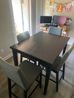 Bar height table and 4 chairs