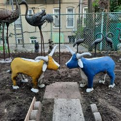Large Metal Bulls. 22" tall & 40" wide. Can be spray painted to look brand new. $200 For Both