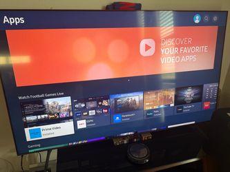 65 inch UHD Samsung TV with a remote