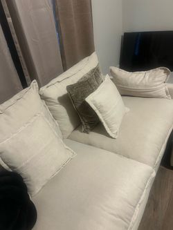 U shaped sectional, Table, curtains, and picture. Pillows included