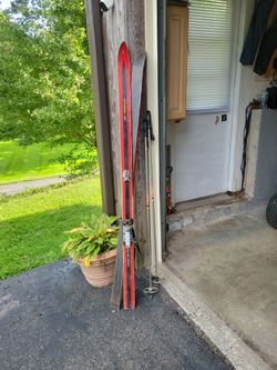Vintage Red Downhill Skis with Pole