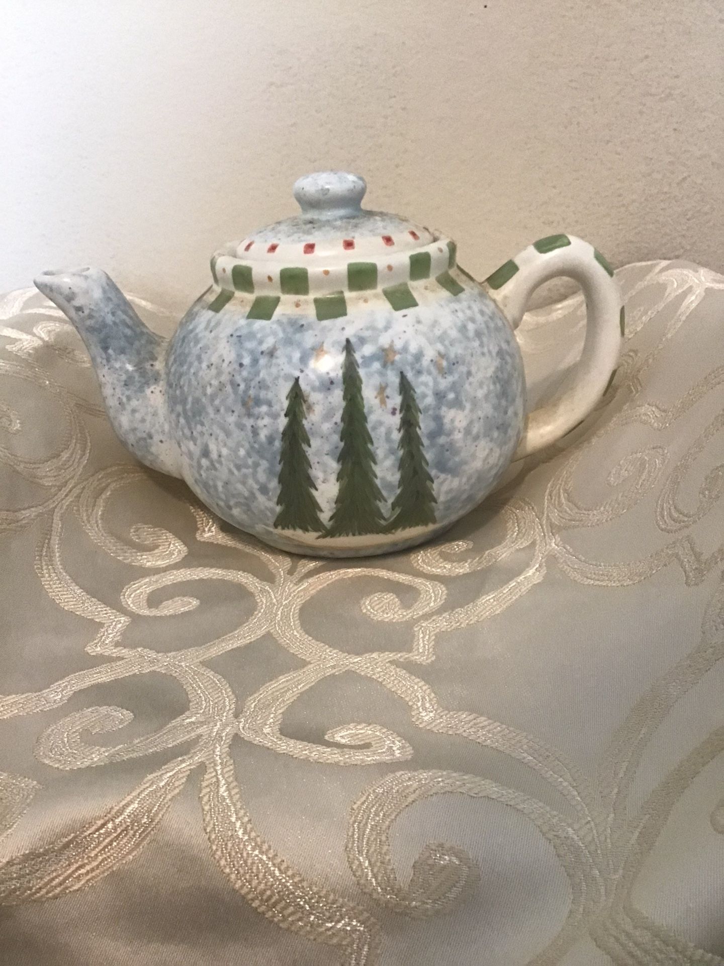 Christmas Teapot by Angie Anderson beautiful holiday trees with stars a light blue backgroun background
