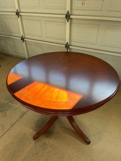 Round mahogany table with inlays