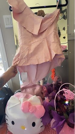 Pink shirt cut off one shoulder