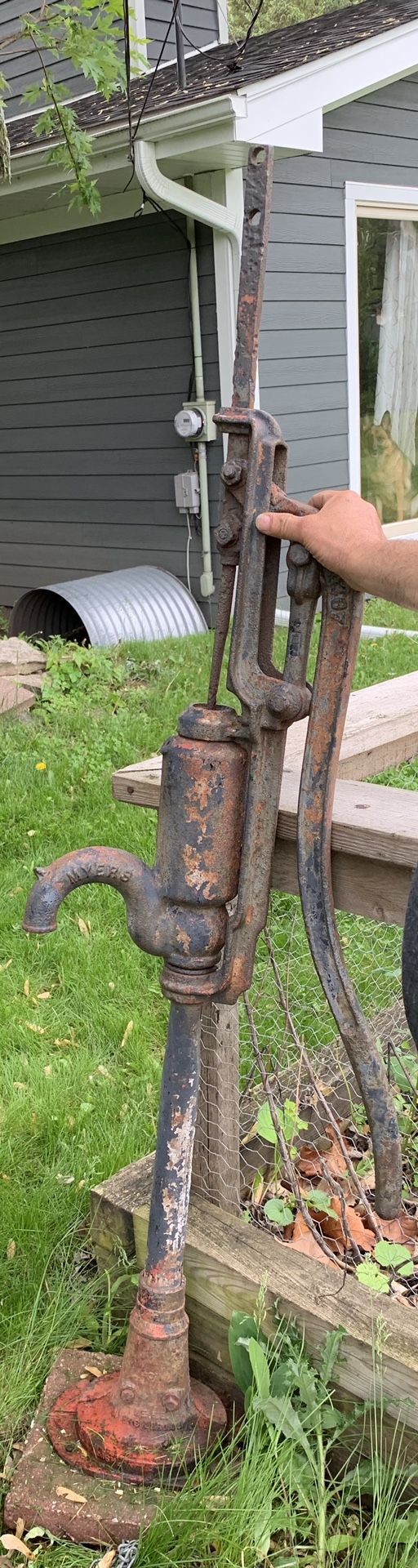 Antique tall cast iron industrial well pump. F.E Meyers pitcher water