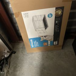 Never opened kennel and 2 unworn pup coats.