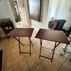 2 brown folding tv tray tables