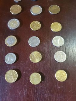 SMALL FOREIGN COIN COLLECTION, INCLUDING A BUFFALO NICKLE AND A ROOSEVELT DIME.