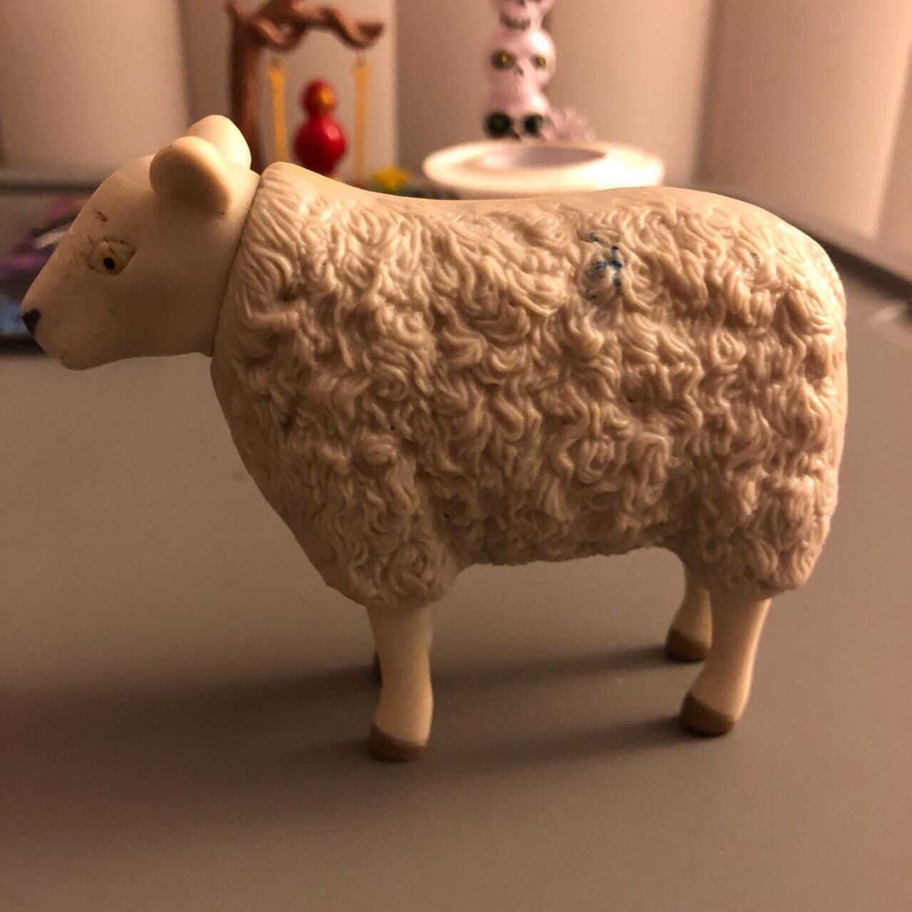 Vintage Sheep Toy with moving legs. White with yellow eyes. Some marks on face, side, and foot as shown on photos