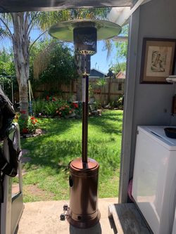 Outdoor propane heater and stand up tables