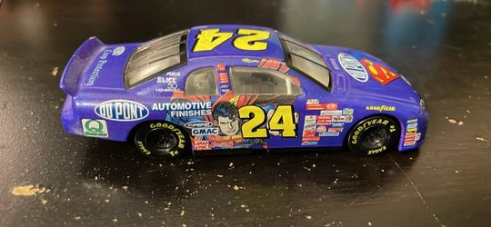 Vintage 1999 Jeff Gordon #24 DuPont Superman NASCAR diecast model car that’s blue and purple