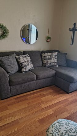 Ashley's Gray sofa 8 ft long with reversible Chase