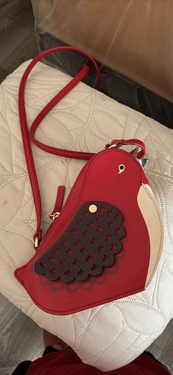 The first person is a Kate Spade rare the second purse is an imitation designer