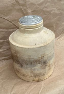 antique lined stoneware gallon crock with metal lid