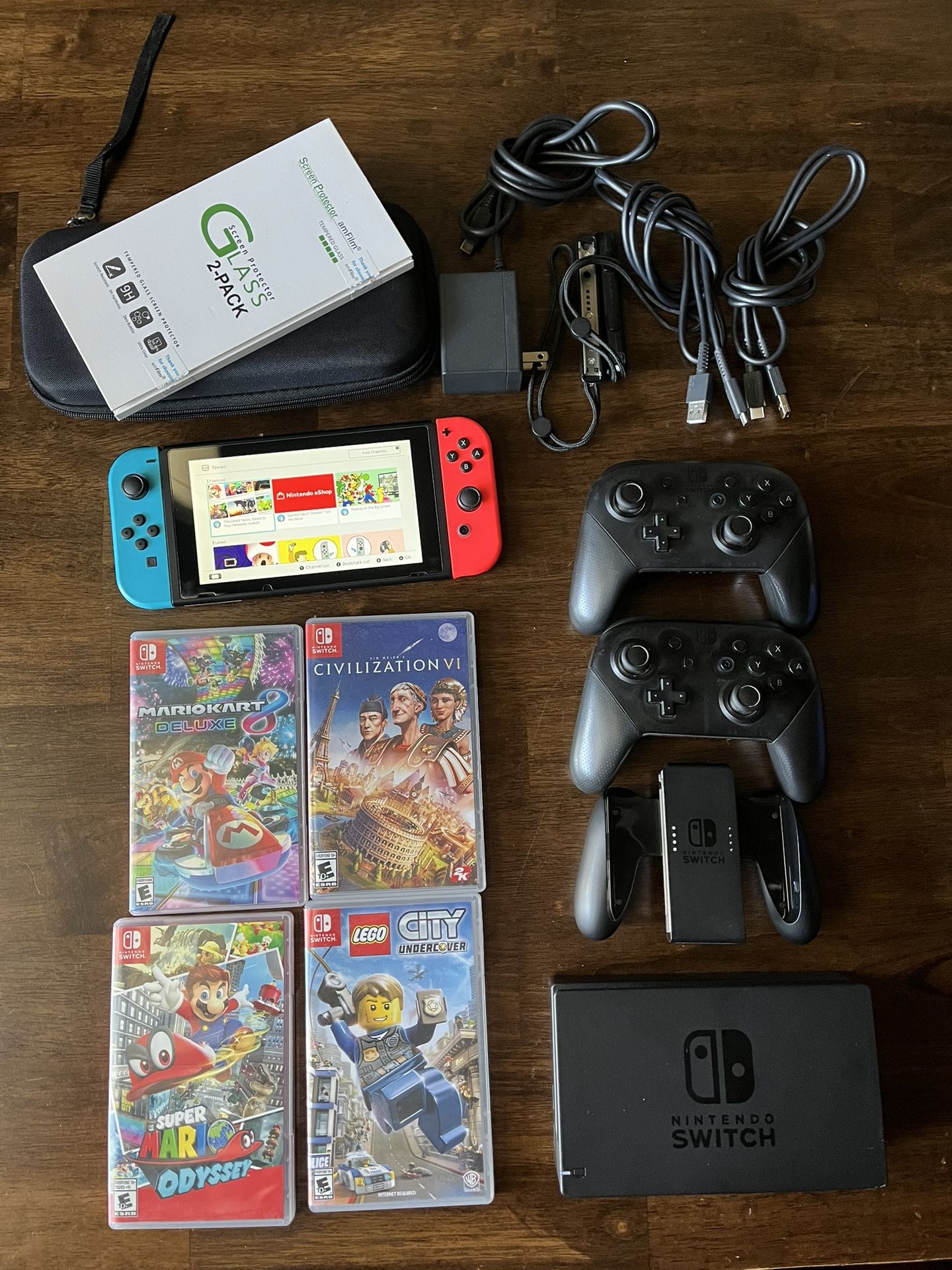 Nintendo Switch 1 (red/blue) w/ 2 pro controllers, 4 games, & accessories