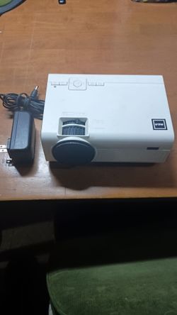 Projector home Theater,  In Great Condition Multiple connections HDMI, USD, MICRO SD, AV, EARPHONES, SPEAKER NO ISSUES.