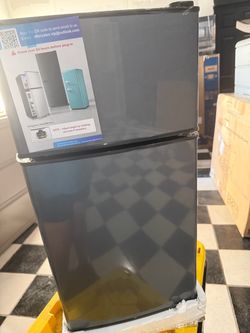 mini refrigerator with a top-mounted freezer