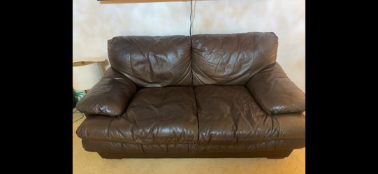 Brown leather couch and loveseat
