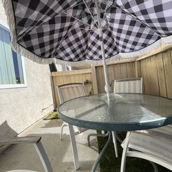 Patio Set with chairs, table and beautiful umbrella