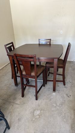 Solid wood table with leaf and 4 chairs