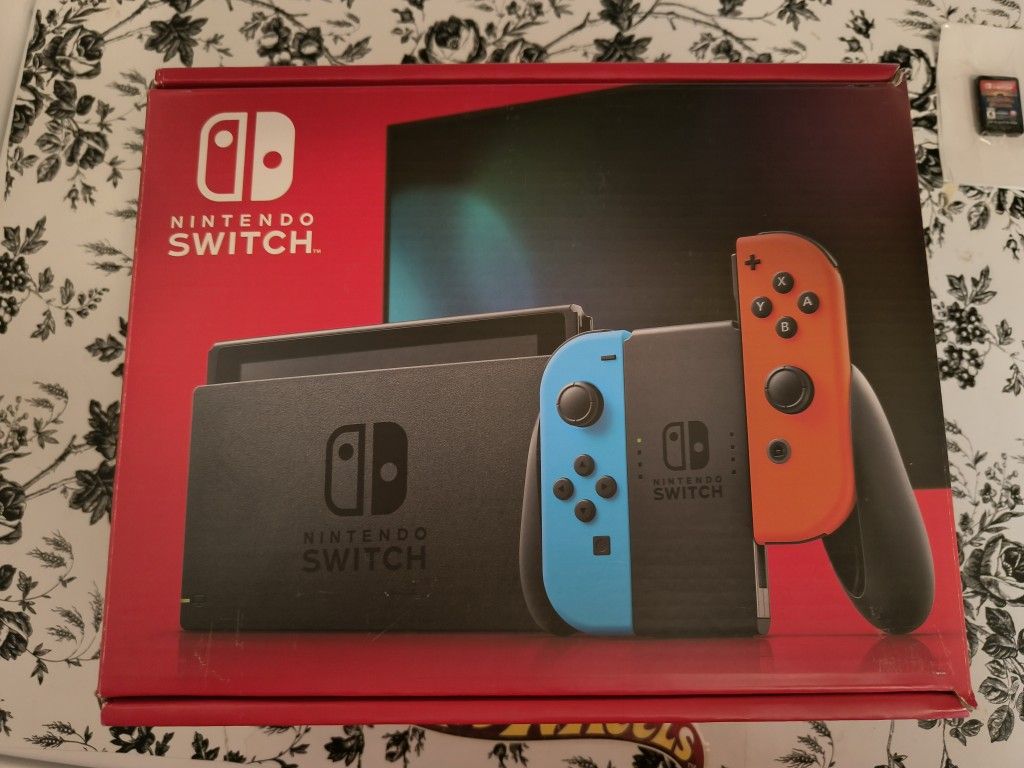 NEW...Nintendo Switchâ„¢ w/ Neon Blue & Neon Red Joy-Con